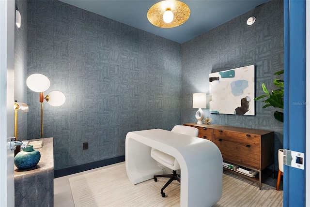 office space with wallpapered walls