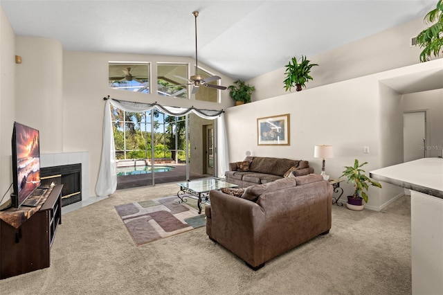 15014 Arbor Hollow Dr, Odessa, FL 33556 - carpeted living room featuring a ceiling fan, a tile fireplace, and high vaulted ceiling