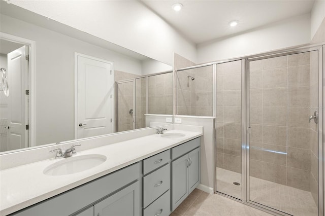12323 Hearts Ease St, Venice, FL 34293 - bathroom featuring a sink, tile patterned flooring, double vanity, and a stall shower