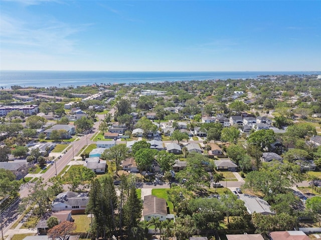 drone / aerial view featuring a residential view and a water view