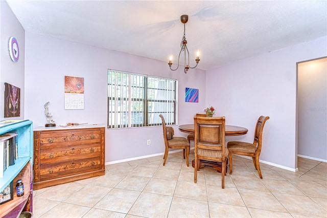 4110 Summerdale Dr, Tampa, FL 33624 - dining room featuring light tile patterned flooring, baseboards, and a chandelier