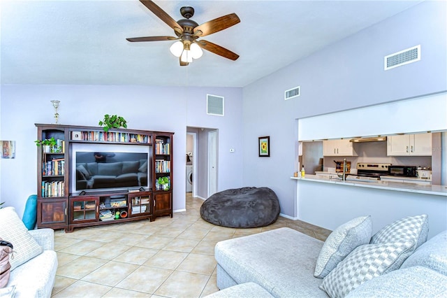 4110 Summerdale Dr, Tampa, FL 33624 - living area with a ceiling fan, light tile patterned floors, and visible vents