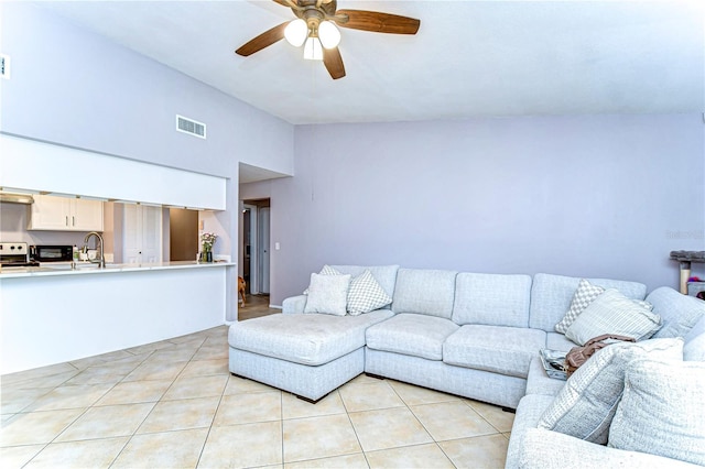 4110 Summerdale Dr, Tampa, FL 33624 - living room with visible vents, a ceiling fan, lofted ceiling, and light tile patterned floors