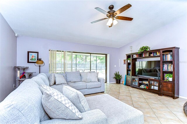 4110 Summerdale Dr, Tampa, FL 33624 - living room with baseboards, ceiling fan, and light tile patterned floors