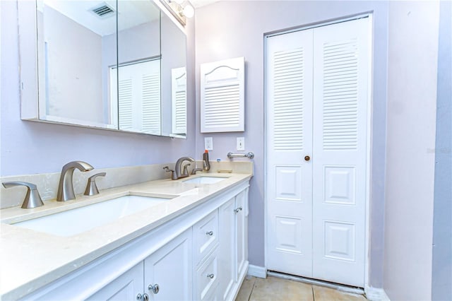 4110 Summerdale Dr, Tampa, FL 33624 - bathroom with tile patterned flooring, a sink, a closet, and visible vents