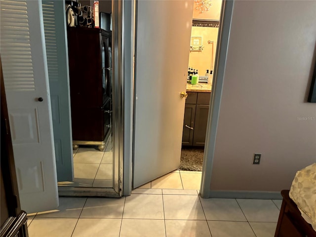 1312 Foxboro Dr, Brandon, FL 33511 - hall with light tile patterned floors and baseboards