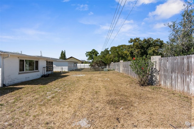view of yard with a fenced backyard