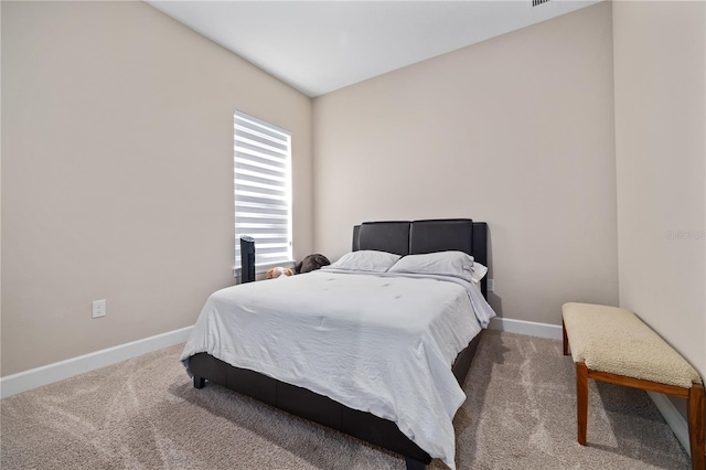carpeted bedroom with baseboards