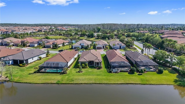 aerial view with a water view and a residential view