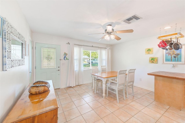 700 16th St NW, Largo, FL 33770 - dining area with baseboards, a ceiling fan, visible vents, and light tile patterned flooring