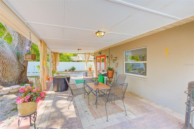 700 16th St NW, Largo, FL 33770 - view of patio / terrace featuring outdoor dining area and fence