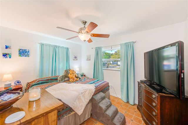 700 16th St NW, Largo, FL 33770 - bedroom with light tile patterned flooring and a ceiling fan