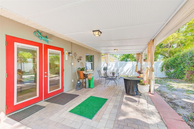 700 16th St NW, Largo, FL 33770 - view of patio featuring outdoor dining space and fence