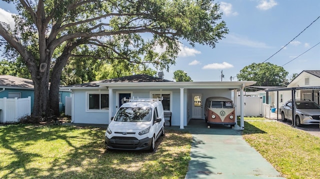 2808 W Lake Ave, Tampa, FL 33607 - single story home featuring a front yard, fence, and an attached carport