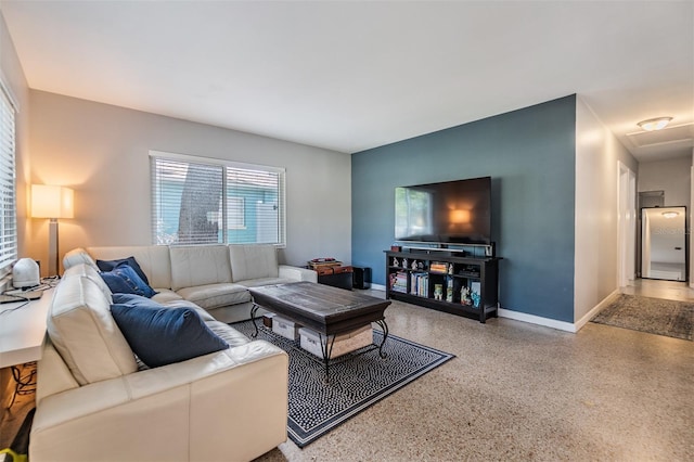 2808 W Lake Ave, Tampa, FL 33607 - living area with speckled floor and baseboards