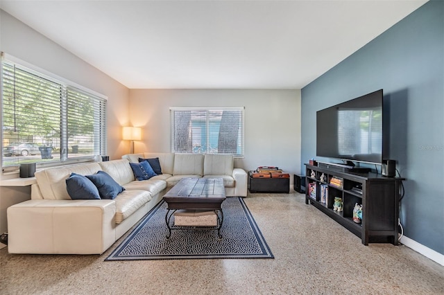 2808 W Lake Ave, Tampa, FL 33607 - living room featuring speckled floor and baseboards