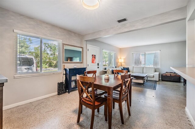 2808 W Lake Ave, Tampa, FL 33607 - dining room featuring visible vents, baseboards, and speckled floor