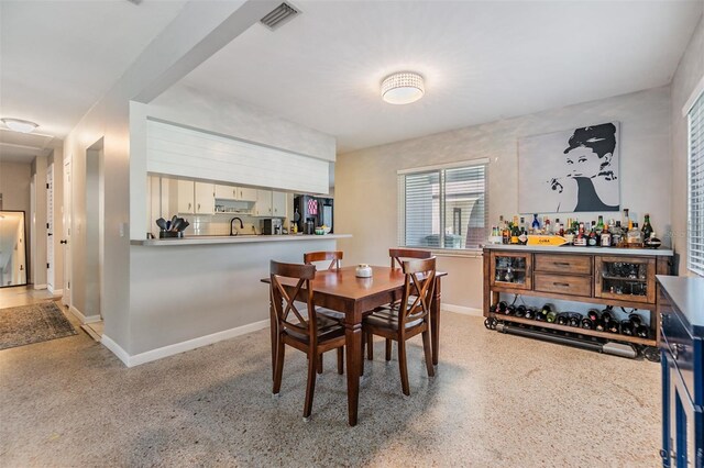 2808 W Lake Ave, Tampa, FL 33607 - dining area featuring speckled floor, baseboards, and visible vents
