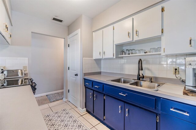 2808 W Lake Ave, Tampa, FL 33607 - kitchen featuring a sink, visible vents, light countertops, and light tile patterned floors