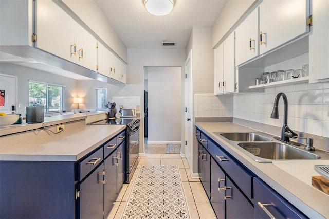 2808 W Lake Ave, Tampa, FL 33607 - kitchen featuring black electric range oven, blue cabinets, a sink, and visible vents