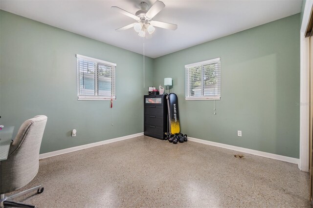 2808 W Lake Ave, Tampa, FL 33607 - office space featuring ceiling fan, baseboards, and speckled floor