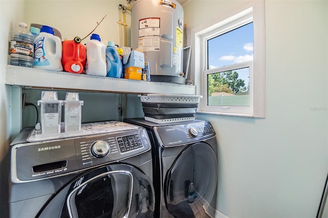 2808 W Lake Ave, Tampa, FL 33607 - clothes washing area featuring electric water heater, independent washer and dryer, laundry area, and baseboards