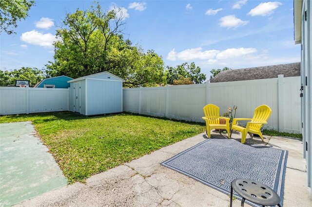 2808 W Lake Ave, Tampa, FL 33607 - view of yard featuring a patio, a fenced backyard, a shed, and an outdoor structure