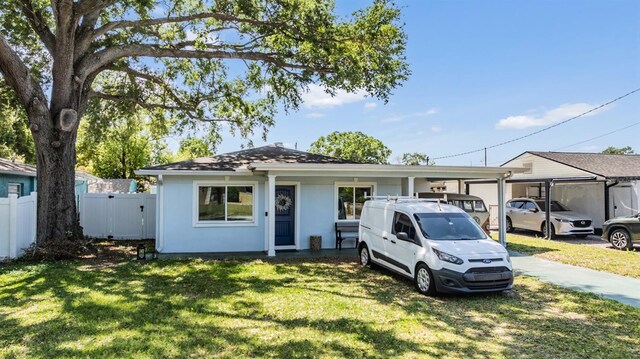 2808 W Lake Ave, Tampa, FL 33607 - single story home featuring a front lawn, fence, and stucco siding