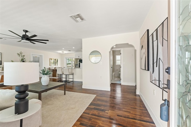 601 Boca Ciega Isle Dr, St Pete Beach, FL 33706 - foyer entrance with visible vents, baseboards, wood finished floors, a ceiling fan, and arched walkways
