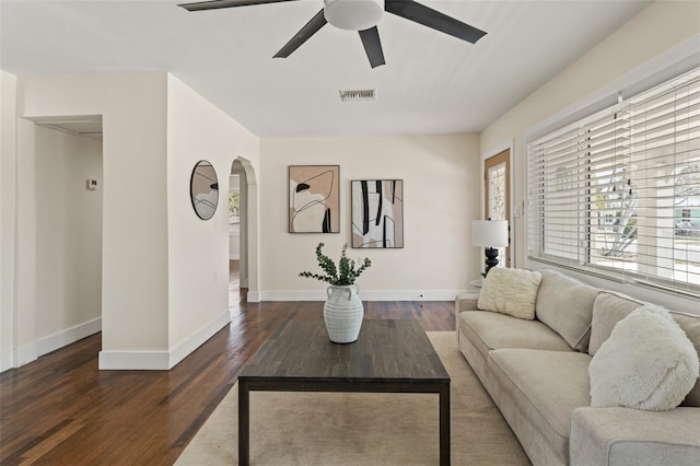601 Boca Ciega Isle Dr, St Pete Beach, FL 33706 - living area with a ceiling fan, wood finished floors, baseboards, visible vents, and arched walkways