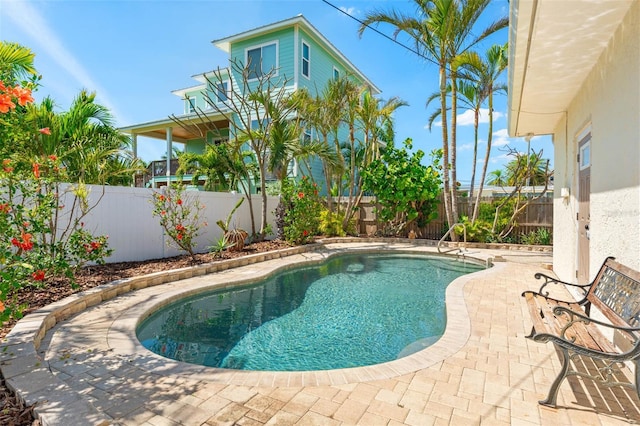 601 Boca Ciega Isle Dr, St Pete Beach, FL 33706 - view of pool with a patio, a fenced in pool, and a fenced backyard