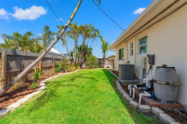 601 Boca Ciega Isle Dr, St Pete Beach, FL 33706 - view of yard featuring a fenced backyard and central AC unit