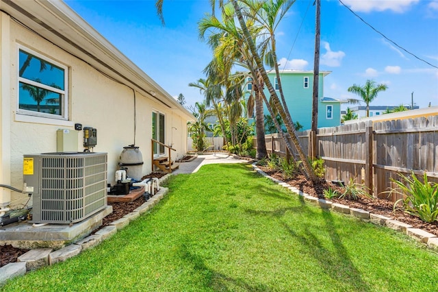 601 Boca Ciega Isle Dr, St Pete Beach, FL 33706 - view of yard with a fenced backyard and central AC