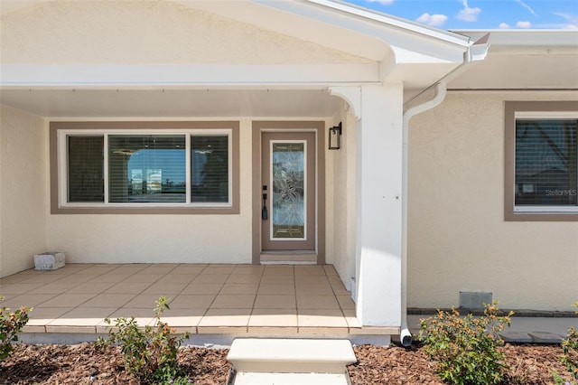 601 Boca Ciega Isle Dr, St Pete Beach, FL 33706 - property entrance with stucco siding and a patio