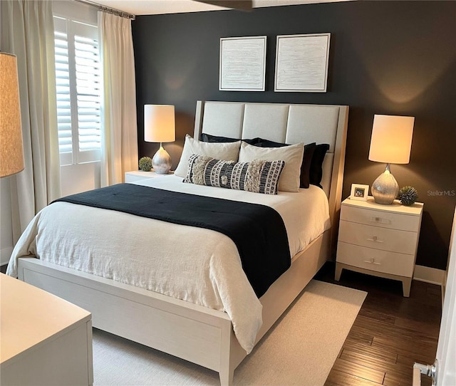 2511 N Grady Ave Unit 82, Tampa, FL 33607 - bedroom featuring dark wood-style floors and baseboards