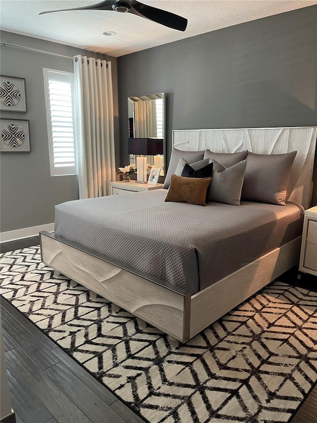 2511 N Grady Ave Unit 82, Tampa, FL 33607 - bedroom with wood finished floors, baseboards, and ceiling fan