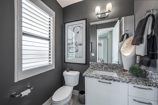 2511 N Grady Ave Unit 82, Tampa, FL 33607 - half bathroom with toilet, vanity, healthy amount of natural light, and baseboards