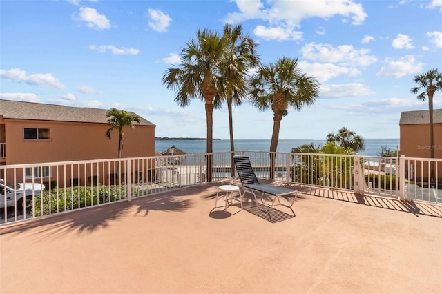 view of patio featuring a water view