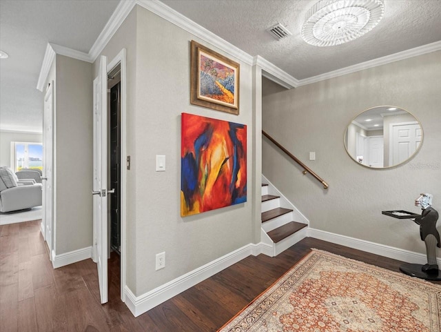 2087 Edgewater Dr Unit C, Clearwater, FL 33755 - stairway with wood finished floors, ornamental molding, and a textured ceiling