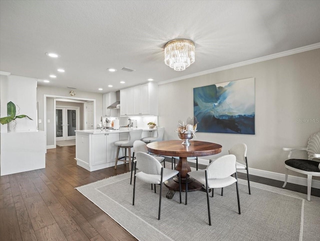 2087 Edgewater Dr Unit C, Clearwater, FL 33755 - dining area featuring dark wood finished floors, crown molding, a chandelier, and recessed lighting