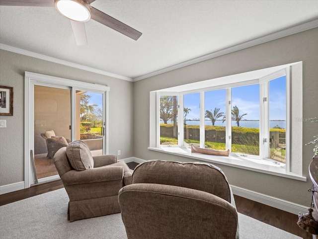 2087 Edgewater Dr Unit C, Clearwater, FL 33755 - living area featuring ornamental molding, a ceiling fan, and wood finished floors