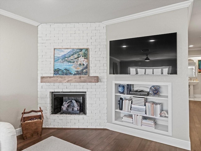 2087 Edgewater Dr Unit C, Clearwater, FL 33755 - living area featuring crown molding, wood finished floors, a brick fireplace, and built in features