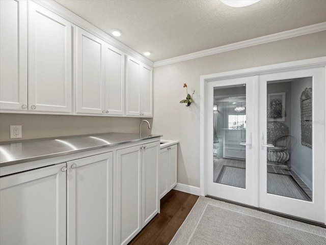 2087 Edgewater Dr Unit C, Clearwater, FL 33755 - kitchen featuring ornamental molding, dark wood-style flooring, white cabinetry, a textured ceiling, and recessed lighting