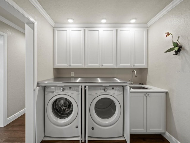 2087 Edgewater Dr Unit C, Clearwater, FL 33755 - laundry room featuring independent washer and dryer, cabinet space, dark wood-style floors, and crown molding