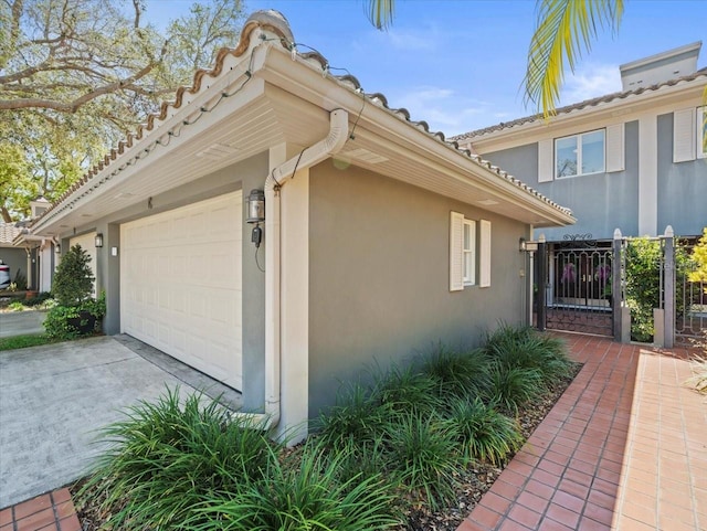 2087 Edgewater Dr Unit C, Clearwater, FL 33755 - view of home's exterior with stucco siding and concrete driveway