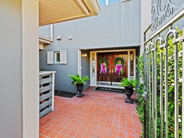 2087 Edgewater Dr Unit C, Clearwater, FL 33755 - view of exterior entry featuring stucco siding