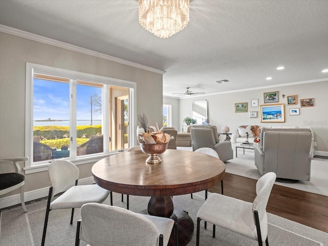 2087 Edgewater Dr Unit C, Clearwater, FL 33755 - dining area featuring crown molding, wood finished floors, a chandelier, recessed lighting, and a ceiling fan