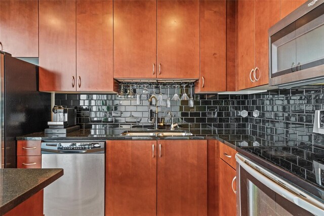 777 N Ashley Dr Unit 2807, Tampa, FL 33602 - kitchen with backsplash, a sink, stainless steel appliances, and dark stone counters