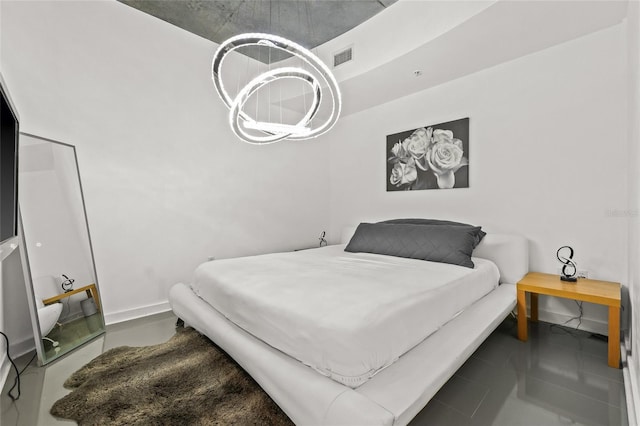 777 N Ashley Dr Unit 2807, Tampa, FL 33602 - bedroom featuring baseboards, visible vents, and an inviting chandelier