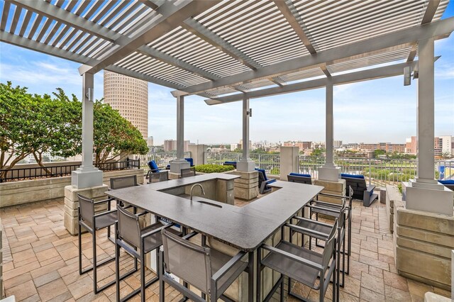 777 N Ashley Dr Unit 2807, Tampa, FL 33602 - view of patio / terrace with outdoor dry bar, fence, outdoor dining space, a city view, and a pergola